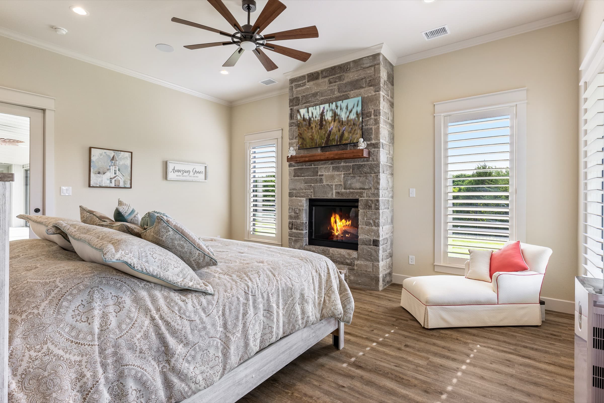 Master bedroom with stone fireplace